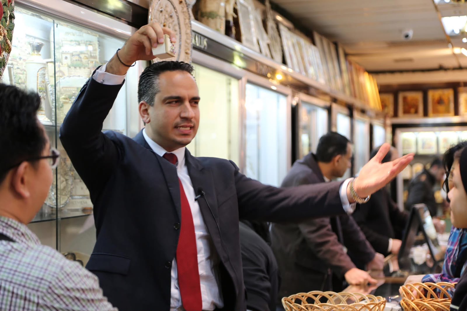 Dr. Maher Nicola Canawati explaining Bethlehem craftsmanship to pilgrims, 2012