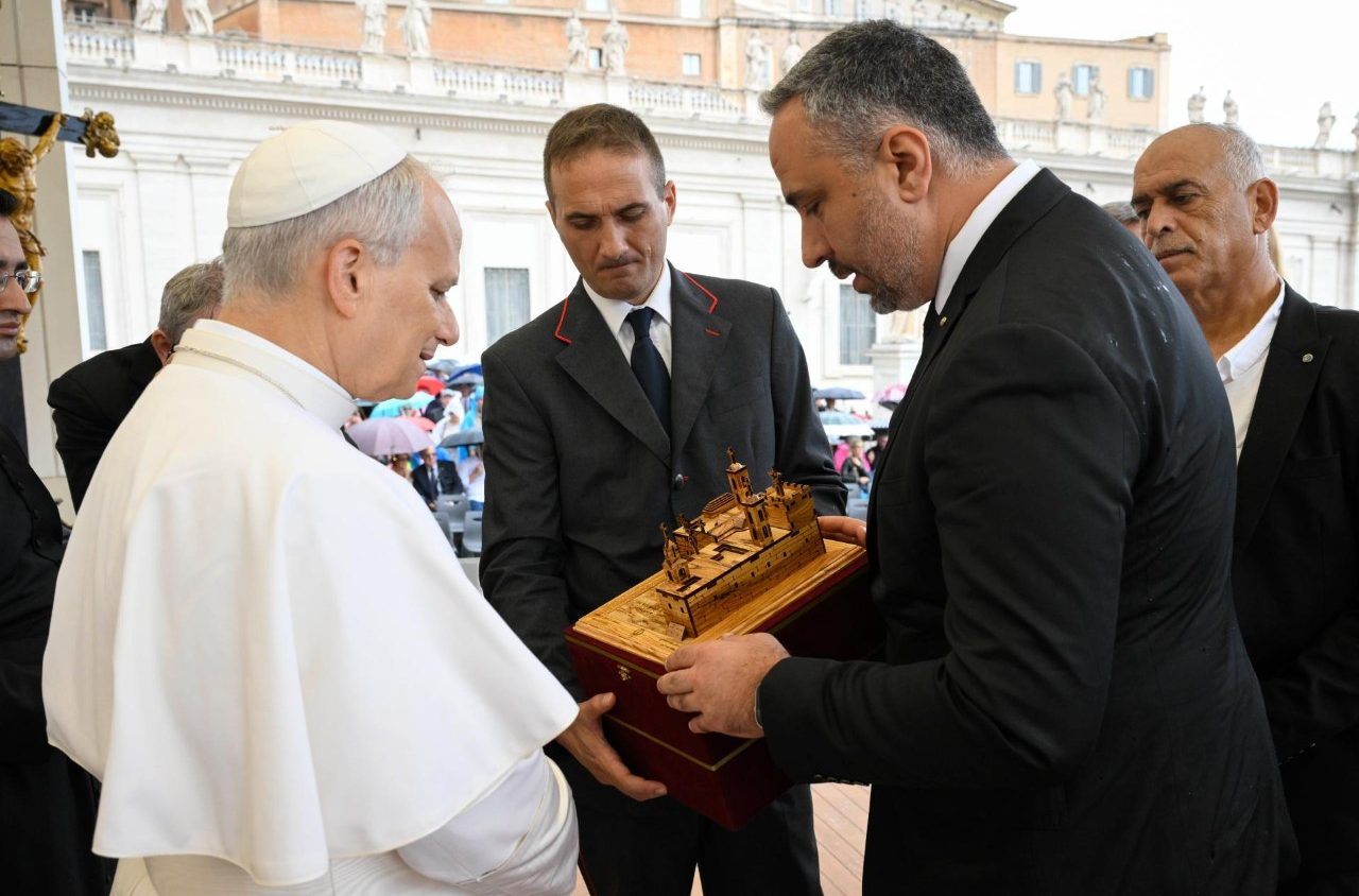 Dr. Maher Nicola Canawati presents Pope Leo XIV with an olive-wood sculpture of the Church of the Nativity